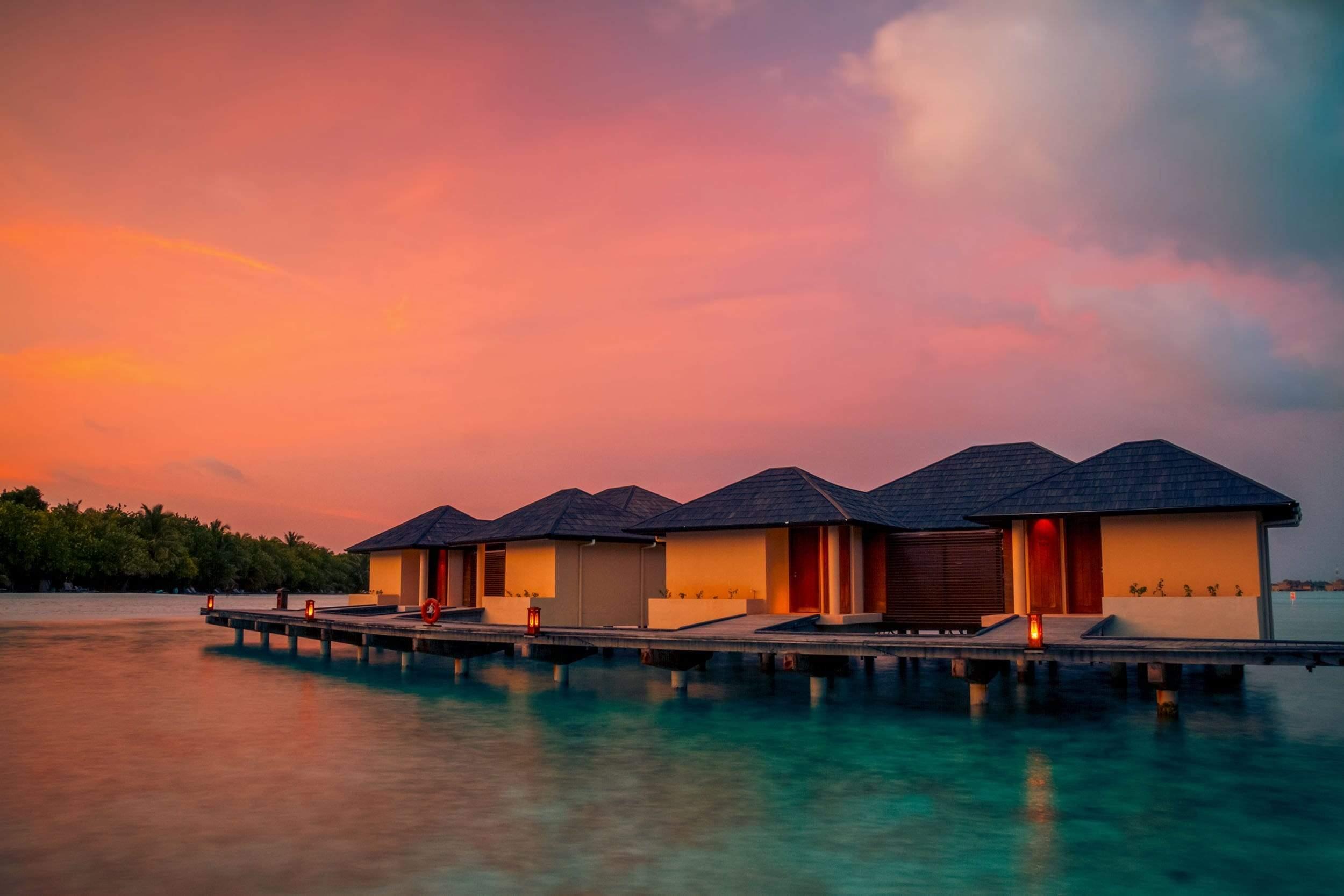 Floating hotels with orange sunset