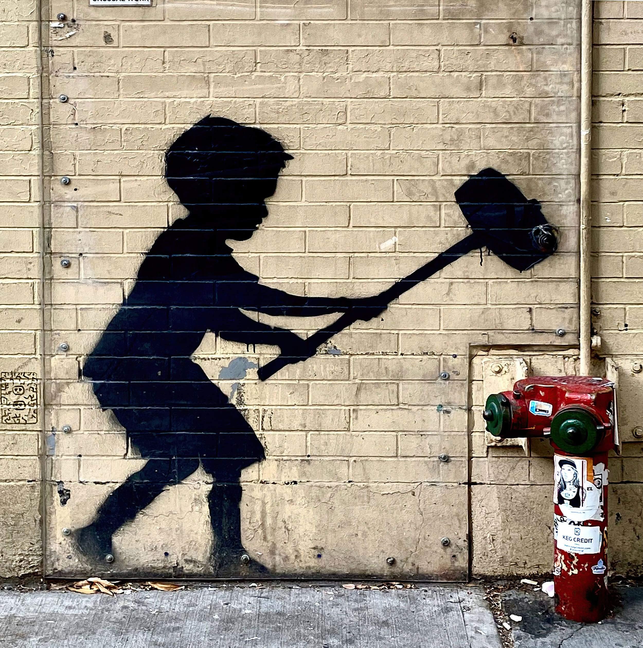 Banksy NYC Child with Hammer: Upper West Side NYC.