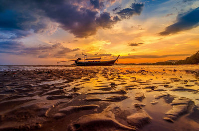 Fishing Boat Japan on sand with orange sunset