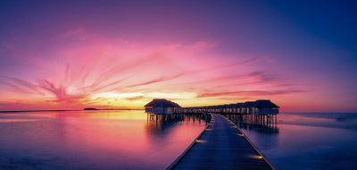 Hotel over water with red sunset