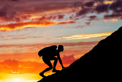 "Keep Climbing" Climber moving up mountain slope is a great motivational shot