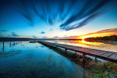 Long dock over blue lake