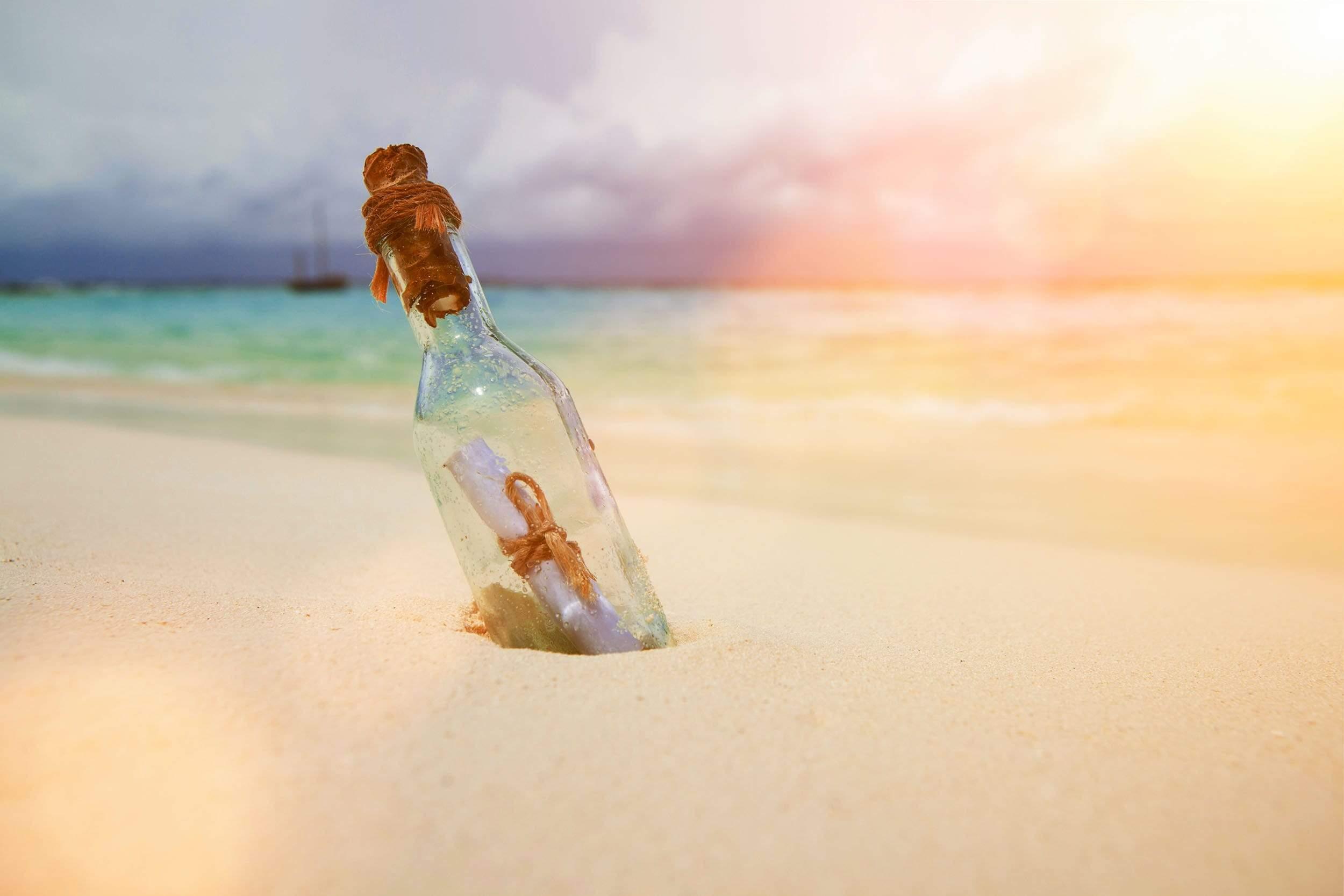 Note in a bottle in the sand