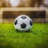 Soccer ball with goal background