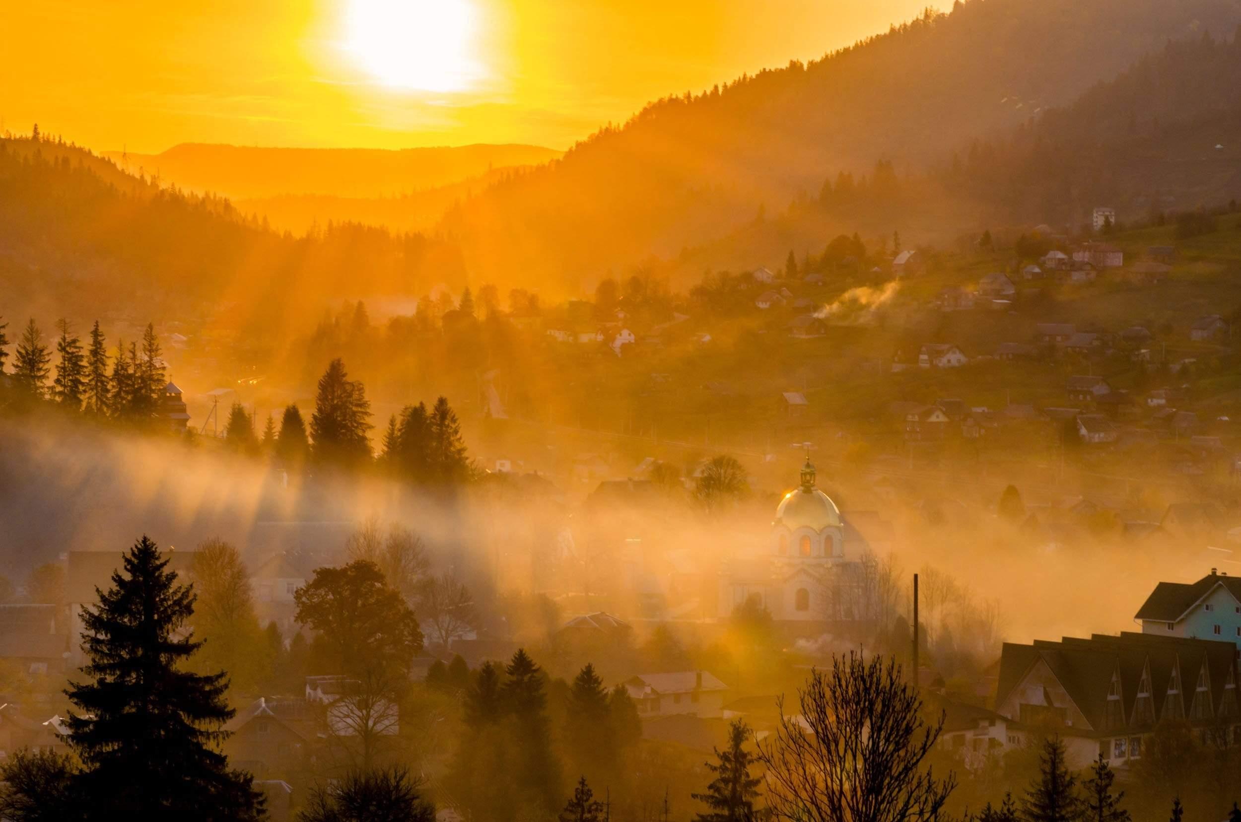 Sunset of misty small town