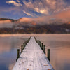 Wooden dock over lake fall colours sunset